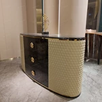 Curved Black and Cream Sideboard Cabinet with Three Central Drawers Textured Side Panels Gold Monogram Pulls and Rounded Profile